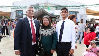 Christopher Fernandes, left, with his family after the Christmas Mass