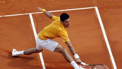 Novak Djokovic returns a shot to Rafael Nadal during his win in the Monte Carlo Masters semi-finals on Saturday. Jean-Paul Pelissier / Reuters / April 18, 2015