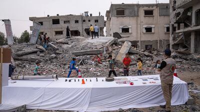 Residents of Deir Al Balah view fragments of exploded Israeli missiles in an exhibition intended to draw attention to the damage caused to homes. AP