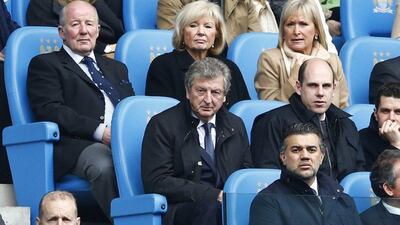 England manager Roy Hodgson, centre, watches Manchester City play Southampton during their Premier League match at the Etihad Stadium in Manchester Saturday. Darren Staples / Reuters / April 5, 2014