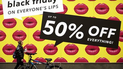A shop front displays its Black Friday sales in Oxford Circus in London, England. Shoppers Look For Bargains On Black Friday. Getty Images