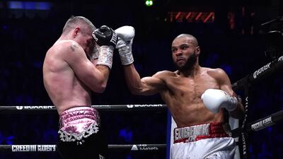 Liam Smith blocks a punch from Chris Eubank Jr during their middleweight bout. PA