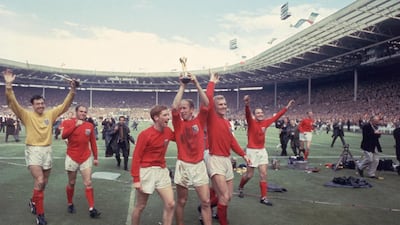 Gordon Banks is seen on the far left as Bobby Charlton raises the Jules Rimet trophy in the air following England's 4-2 victory after extra time over West Germany in the World Cup Final at Wembley Stadium in 1966. Getty Images