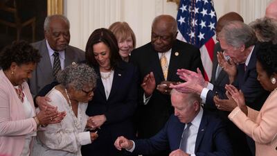Kamala Harris looks on as US President Joe Biden signs the Juneteenth National Independence Day Act at the White House on June 17, 2021. AFP