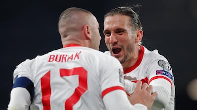Turkey's forward Burak Yilmaz (left) celebrates with Turkey's defender Caner Erkin after scoring his second goal. AFP
