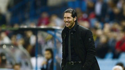 Diego Simeone has led his squad to 11 wins in 12 Primera Liga contests and a 100 per cent record in Champions League group play. Javier Soriano / AFP