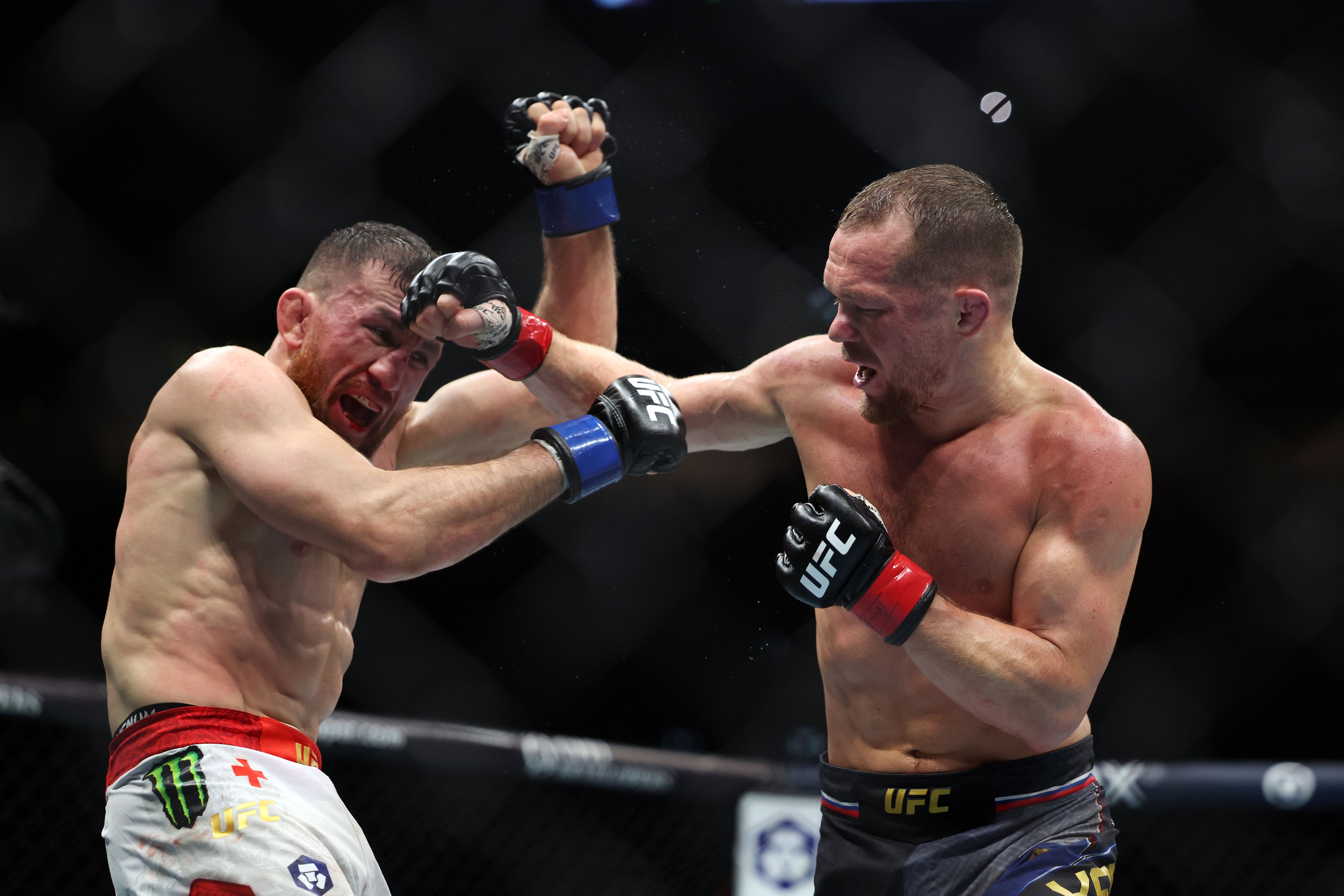 Petr Yan, right, and Merab Dvalishvili were awarded Fight of the Night for their epic encounter at UFC 333. Chris Whiteoak / The National