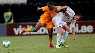 Meite Yakou, left, of Ivory Coast tangles with New Zealand's Cory Brown during their FIFA Under 17 World Cup match on Wednesday. Satish Kumar / The National