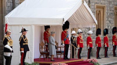 Britain's Queen Elizabeth II watches a military ceremony to mark her official birthday at Windsor Castle on June 12, 2021 in Windsor. AFP