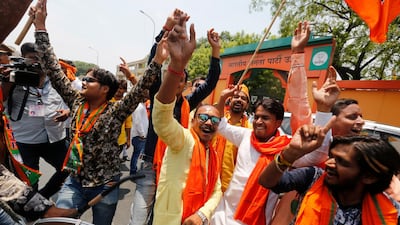 Bharatiya Janata Party (BJP) workers celebrate at BJP headquarters in, Lucknow, India. AP Photo