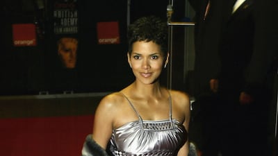 Halle Berry, in silver satin, arrives for the Baftas at the Odeon Leicester Square on February 23, 2003 in London, England. Getty Images