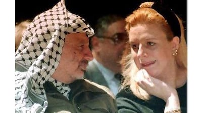 A reader says we should find the cause of death of Yasser Arafat, pictured in 1995 with his wife Suha. Nabil Judah / AP