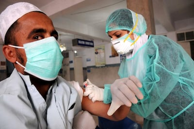 A patient suffering from H1N1 influenza receives medical treatment at a hospital in Multan, Punjab province, Pakistan on January 5. Faisal Kareem / EPA