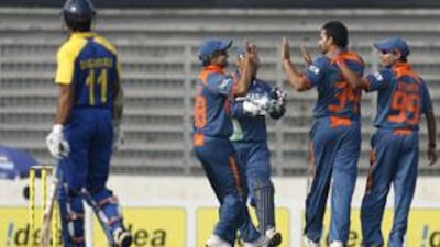 Zaheer Khan, second from right, celebrates the dismissal of Mahela Jayawardene. Both Khan and Amit Mishra picked up three wickets each.