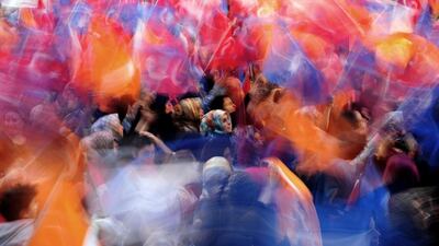 Supporters of the ruling Justice and Development Party (AKP) wave flags during a campaign rally in Istanbul, Turkey. Ozan Kose / AFP