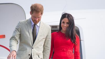 Prince Harry, Duke of Sussex and Meghan, Duchess of Sussex arrive at Fua'amotu Airport on October 25. Getty