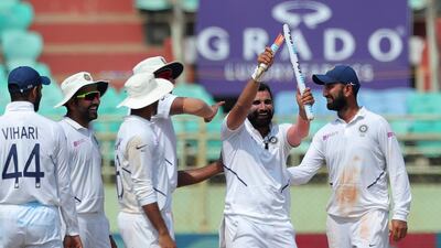India fast bowler Mohammed Shami, second right, celebrates after dismissing South Africa's Dane Piedt during the final day of the first Test against South Africa in Visakhapatnam. AP