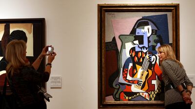 Harlequin the Musician by Picasso. Getty Images