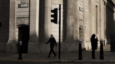 A pedestrian walks past the Bank of England in the City of London. The Monetary Policy Committee voted unanimously to increase their bond-buying programme to prop up the economy during the second wave of Covid-19. Bloomberg