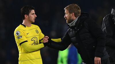 Brighton manager Graham Potter shakes hands with Chelsea midfielder Mason Mount after the Premier League game on January 18, 2022. AFP