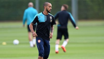 Arsenal's Theo Walcott shown in action during a training session on Monday ahead of their Champions League match against Olympiakos on Tuesday. Andy Rain / EPA