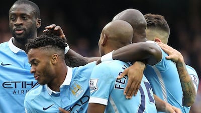 Manchester City's Raheem Sterling celebrates a goal with teammates on Saturday during their Premier League win over Bournemouth. Lindsey Parnaby / AFP / October 17, 2015