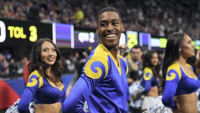 Rams cheerleader Quinton Peron smiles during Super Bowl LIII between the New England Patriots and the Los Angeles Rams at Mercedes-Benz Stadium in Atlanta, Georgia. AFP