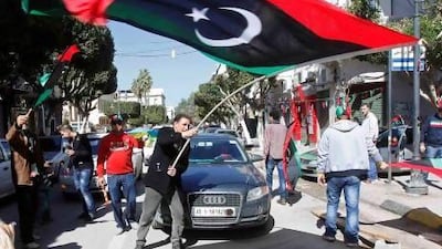 A man waves a Libyan flag during celebrations commemorating the second anniversary of the February 17 revolution in Tripoli. Ismail Zitouny / Reuters