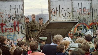 1989: From 1961 to 1989, Berlin was a divided city. Physically by a concrete barrier, but also ideologically by the Soviet government in the East and Germany’s Federal Republic in the West. Civil unrest led to the eventual fall of the wall on November 11, 1989. In this photo by Gerard Malie, West Berliners watch as the East German border guards demolish sections of the wall, the first step to the unification of both sides. AFP