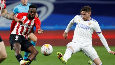 Real Madrid midfielder Federico Valverde attempts to block a shot from Athletic striker Inaki Williams. EPA