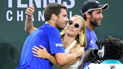 Cameron Norrie, left, of Britain, gets a hug from Louise Jacobi after he defeated Nikoloz Basilashvili, of Georgia. AP Photo