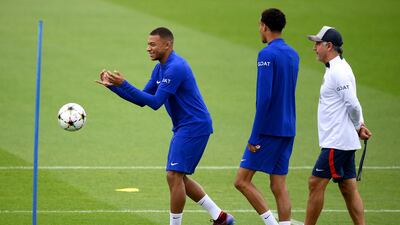 Kylian Mbappe, Hugo Ekitike and manager Christophe Galtier. AFP
