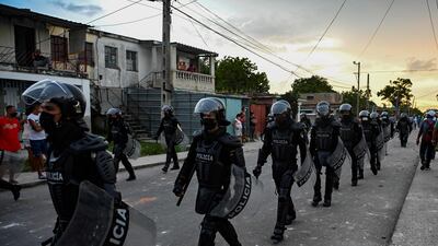 Riot police walk the streets after a demonstration against the government of President Miguel Diaz-Canel in Arroyo Naranjo Municipality, Havana. Cuba on Monday blamed the US for unprecedented anti-government protests, as President Joe Biden backed calls to end "decades of repression" on the communist island. Thousands of Cubans participated in Sunday's demonstrations, chanting "Down with the dictatorship".
