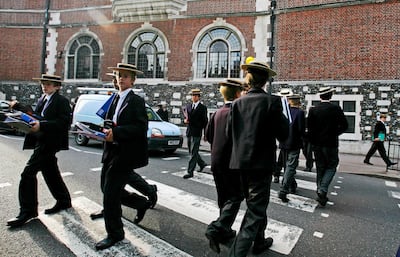 Students from Harrow school cross the road between classes. While fees are expensive at private schools, they can be a springboard to top universities in the UK and US. Getty Images