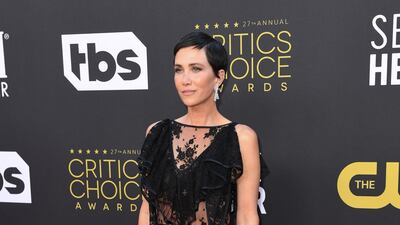 US actress Kristen Wiig arrives in a black lace Rodarte dress. AFP