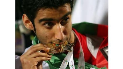 Mohammed Al Qaid celebrates winning one of his four gold medals. cation