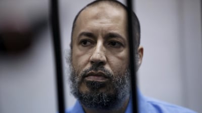 Saadi Qaddafi, son of Muammar Qaddafi, sits behind bars during a hearing at a courtroom in Tripoli, Libya February 7, 2016. Ismail Zitouny / REUTERS
