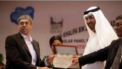 Bangladeshi Ambassador Muhammad Imran, left, and Dr Sultan Ahmed Al Jaber attend a dedication ceremony for the installation of solar panels installed at the Sheikh Khalifa Bangladesh Islamia School in Abu Dhabi yesterday. Sammy Dallal / The National