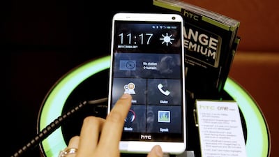 Phablets such as the 5.9-inch HTC One Max, above, are becoming more popular because the combine biggers screens the functionality of mobile phones. Sarah Dea / The National
