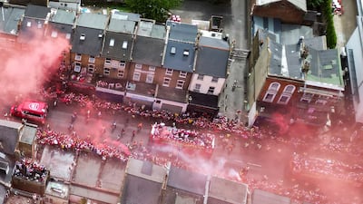 Arsenal fans and players celebrate their first Premier League title in 22 years during a victory parade in Lomdon. AFP