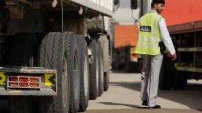A traffic policeman inspects a lorry as part of the campaign to increase safety on the roads of Abu Dhabi.