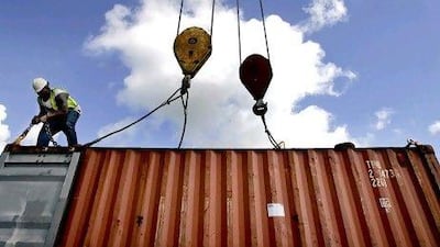 A dock worker at the port of South Louisiana. The US has a trade deficit of more than $650 billion.