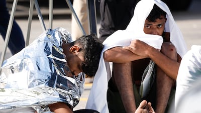 Migrants brought to Malta after their boat capsized close to the island, on December 12, 2025. Reuters