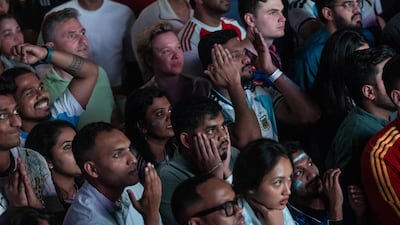 Anxious Argentina fans watch their team take on Spain in the match that went into extra time