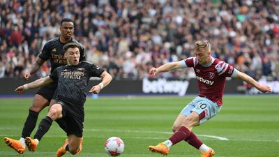 Jarrod Bowen of West Ham United shoots under pressure from Kieran Tierney of Arsenal. Getty Images