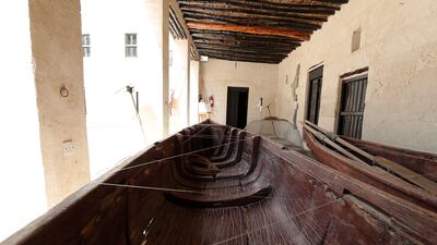 Traditional boats used for fishing and pearl diving on display at the museum.