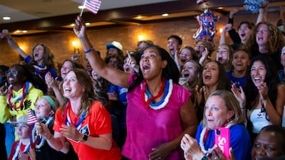 People celebrate during a watch party in Mountainside, New Jersey , the gold medal of Sydney McLaughlin in the women's 400-meter hurdles at the 2020 Tokyo Olympics.