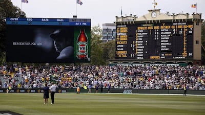 A tribute to former Australian cricketer Phillip Hughes, who was the 408th player for Australia, is displayed on a screen next to the scoreboard during the first day of the third Test between Australia and New Zealand at the Adelaide Oval. David Gray / Reuters