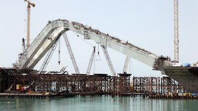 A construction firm estimates the Sheikh Zayed Bridge could be open in October.