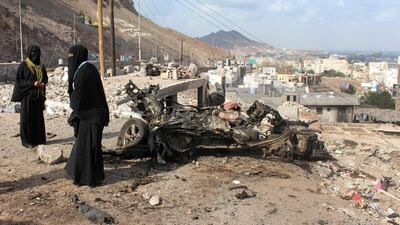 Yemeni women stand next to the site of a car bomb attack that targeted a police checkpoint the night before in Aden's Crater district on January 30, 2016. Saleh Al Obeidi/AFP